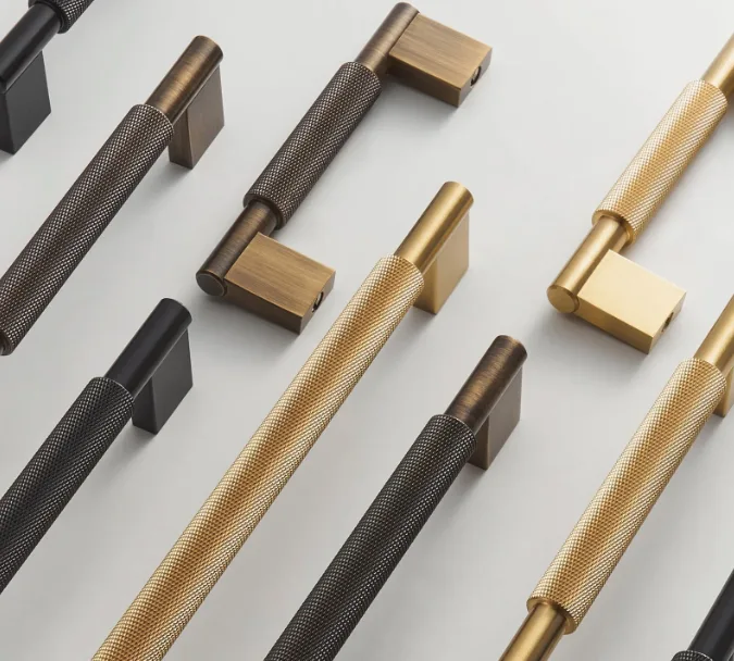 Cabinet hardware finishes arranged for comparison before a Houston cabinet update